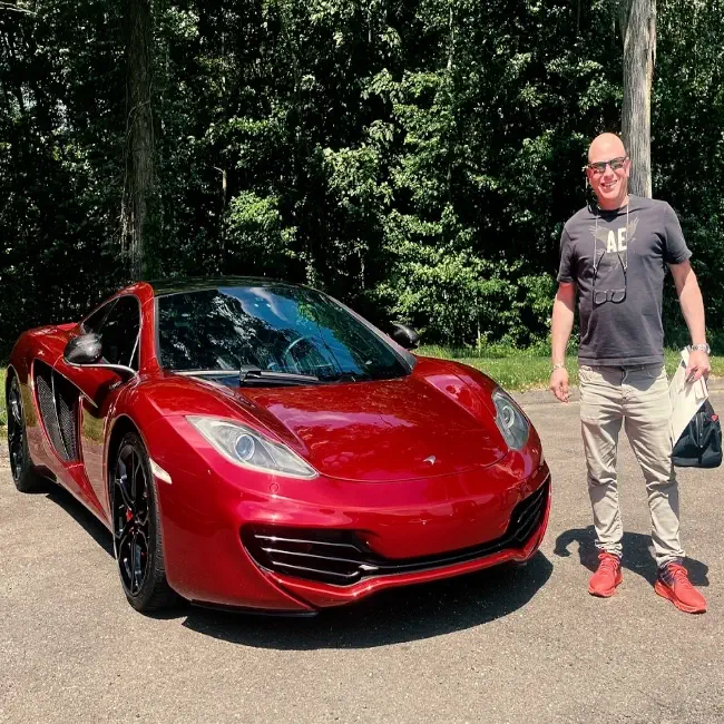 Classic car enthusiast picks up vehicle at Buonauto Enterprises